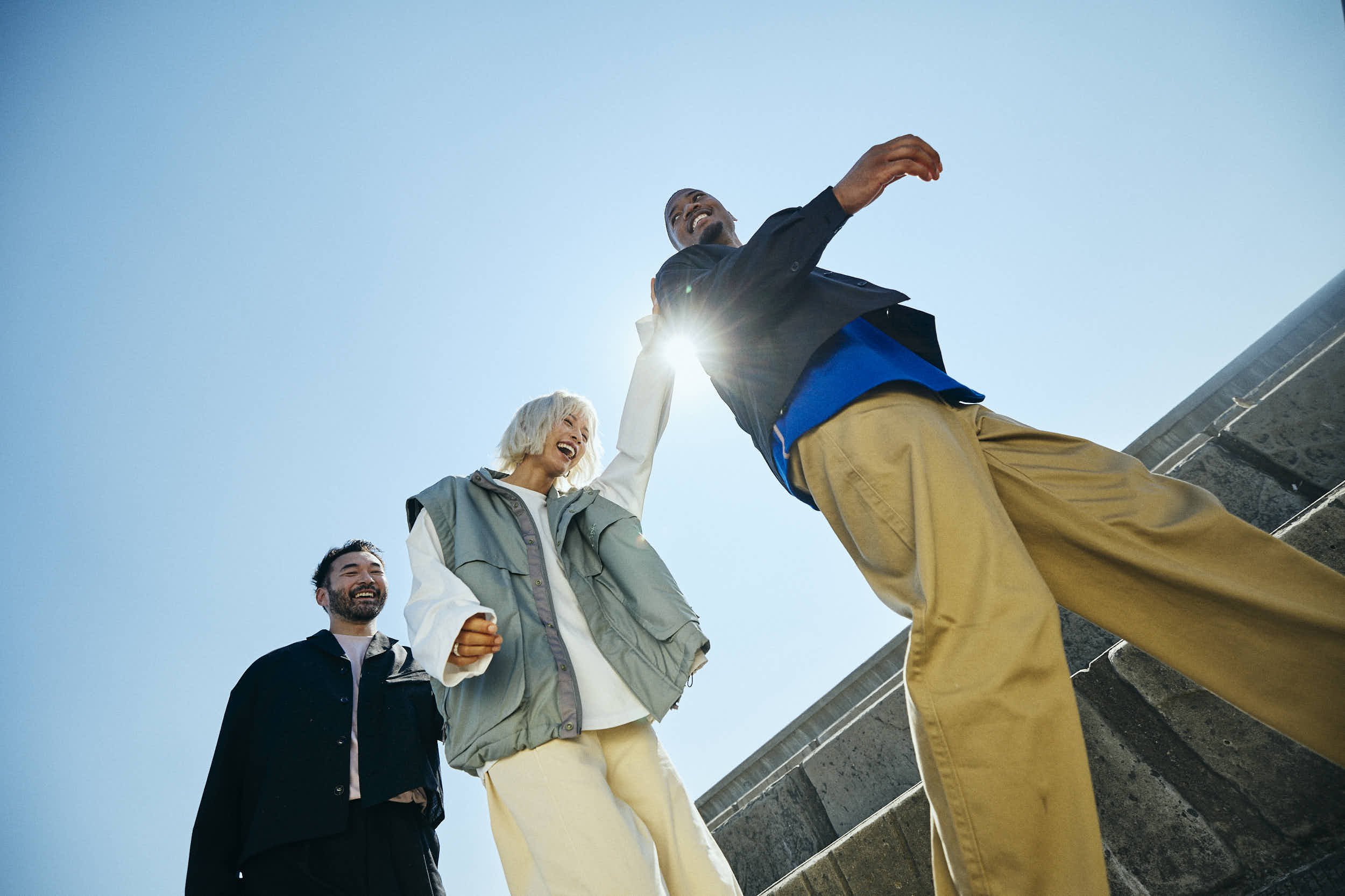 Group laughing on set for an Asics sportstyle campaign
