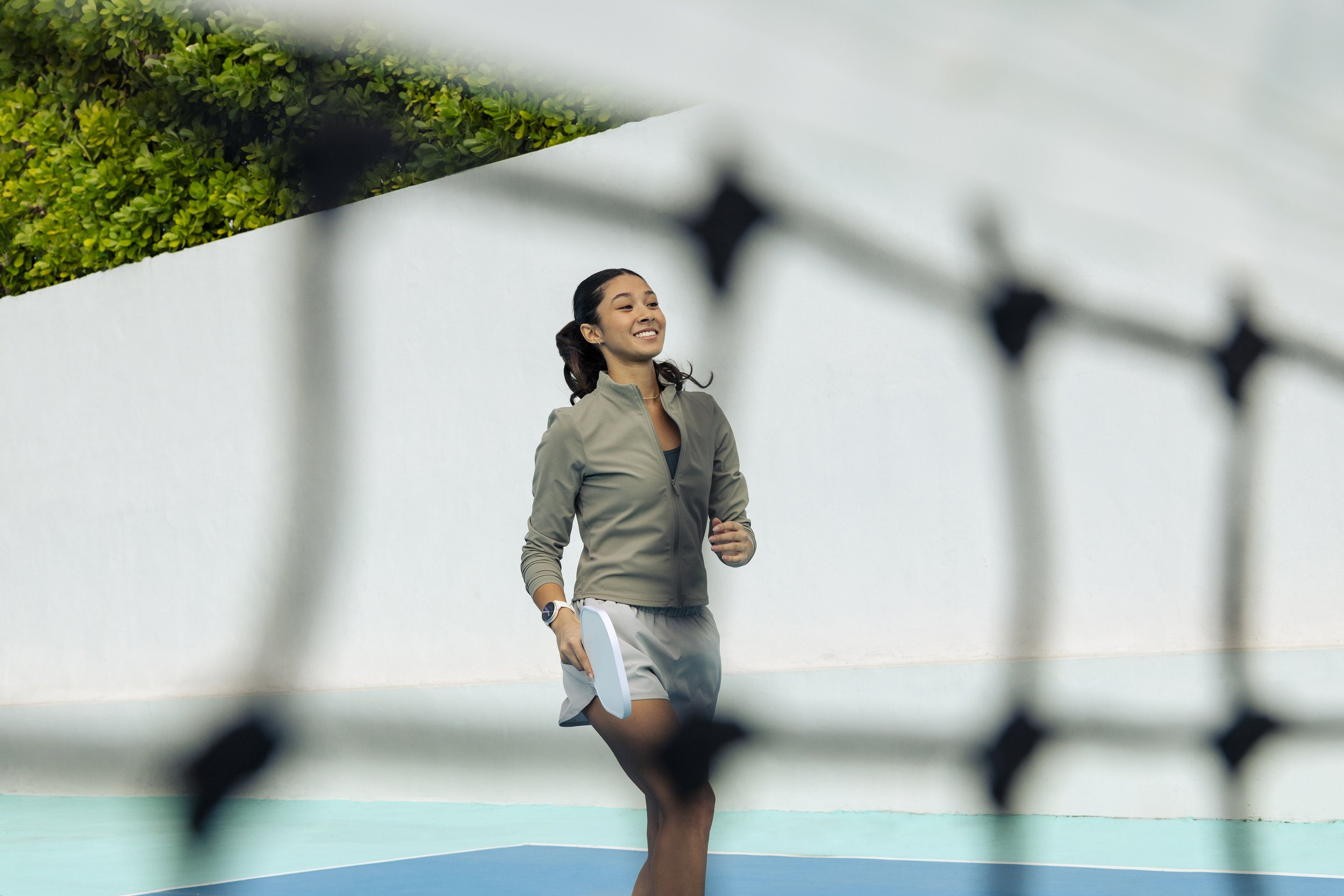 Woman cast for a Garmin campaign on a pickleball court
