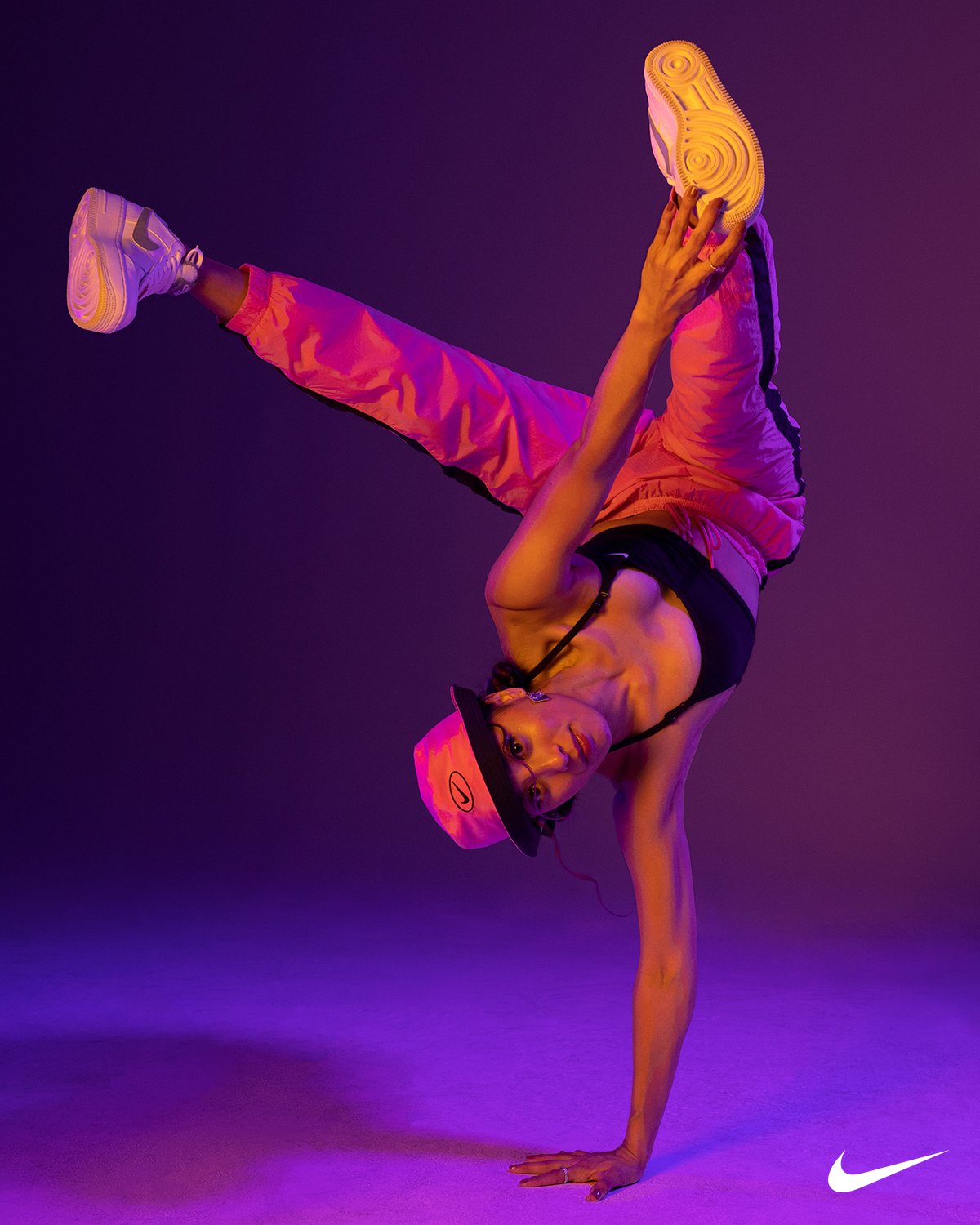 Dancer cast for a Nike campaign holding a one-handed handstand
